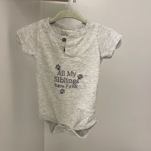 Baby 0-3 months “All my siblings have paws” onesie.